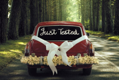 Wedding car with message "Just Tested" on back window